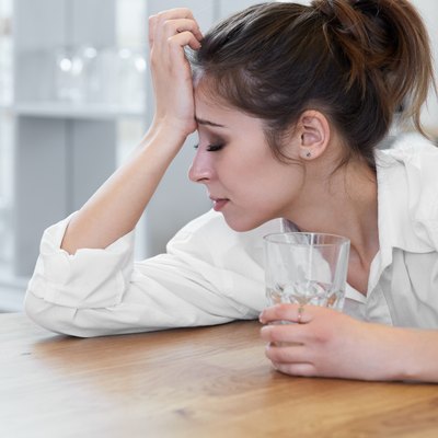 Portrait of woman with headache