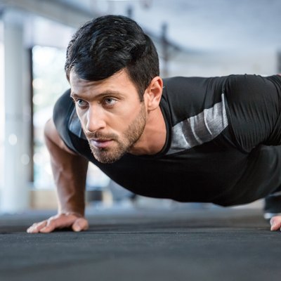 Man doing push ups in gym