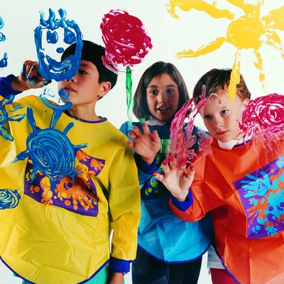 Children painting on glass