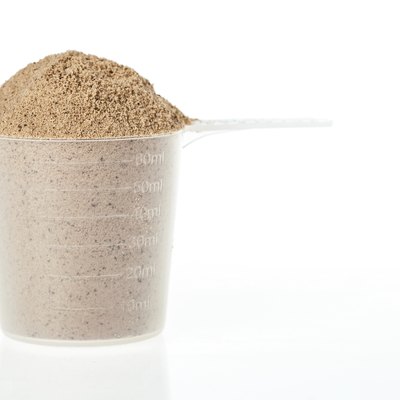 Scoop of chocolate whey protein powder