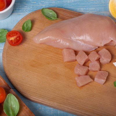 Chicken fillet with cherry tomatoes, mushrooms and basil leaves