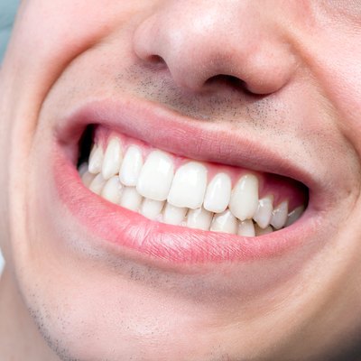 Extreme close up of human male mouth showing teeth.