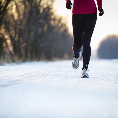 Young woman running outdoors on a cold winter day