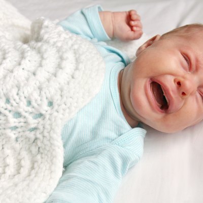 Sweet Newborn Baby Crying in Crib