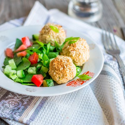 baked chickpeas balls with sesame and vegetable salad,selective focus