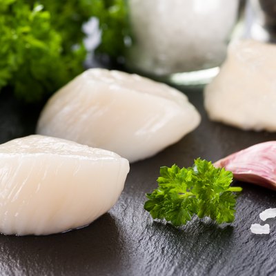 Scallop on black stone plate