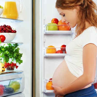 nutrition and diet during pregnancy. Pregnant woman with fruits