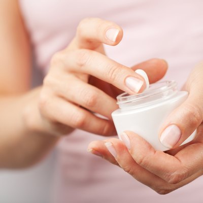 beautiful woman hands with cream