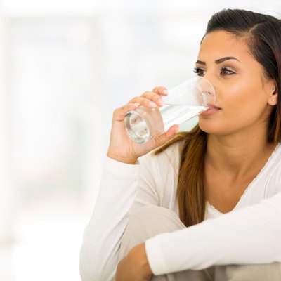 young woman drinking water