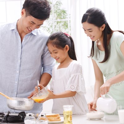 Family cooking in kitchen