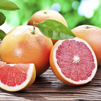 Grapefruits on a wooden table.