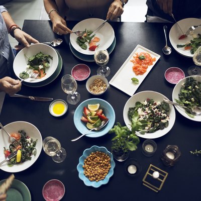 High angle view of multi-ethnic friends eating food at table