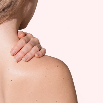 Girl holding neck/shoulder