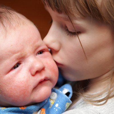Sister kisses her brother