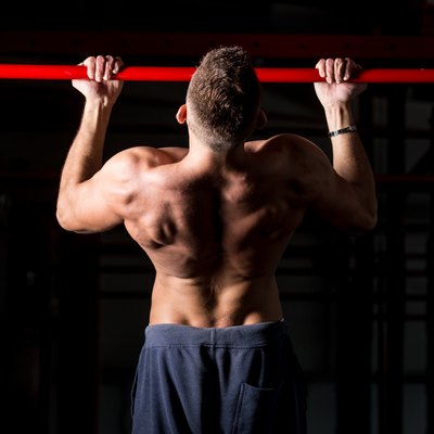 Exercising on chin-up bar