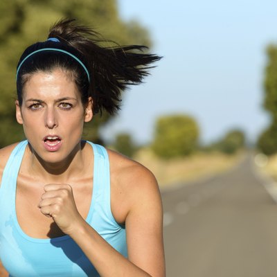 Sport woman running in road