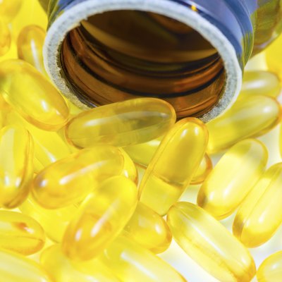 Fish oil pills spilled from container