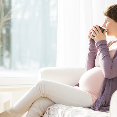 Pregnant woman drinking tea