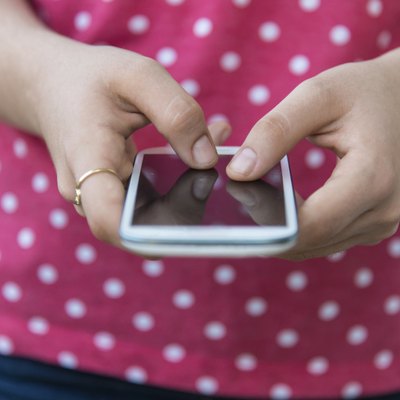 Teenage girl using mobile smart phone