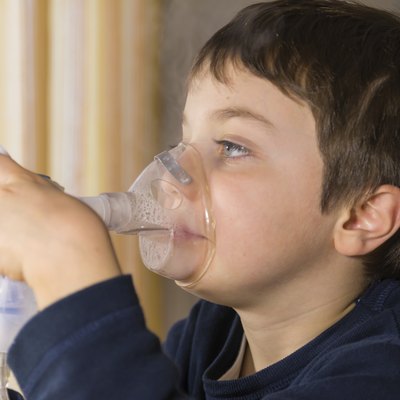 child with inhaler mask