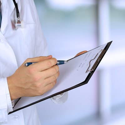 medical doctor with a stethoscope holding a black folder