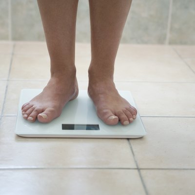 Man's feet on a weighing scale