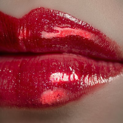 The red plump lip belongs to a Asia girl.
