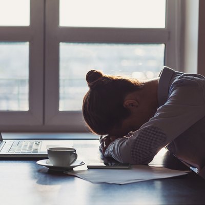 Tired woman in the office