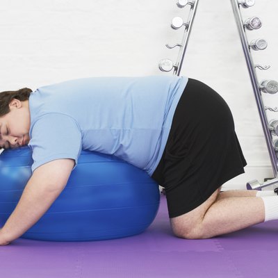 Overweight Man sleeping On Exercise Ball
