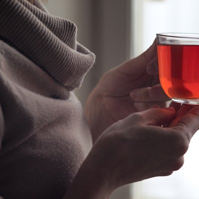 Cup of tea in the woman hands