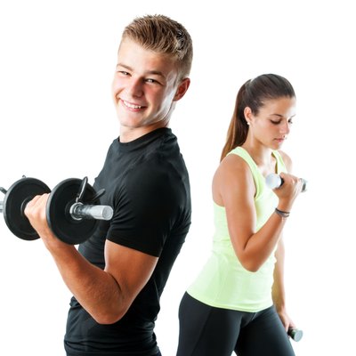 Handsome teen couple working out with weights.