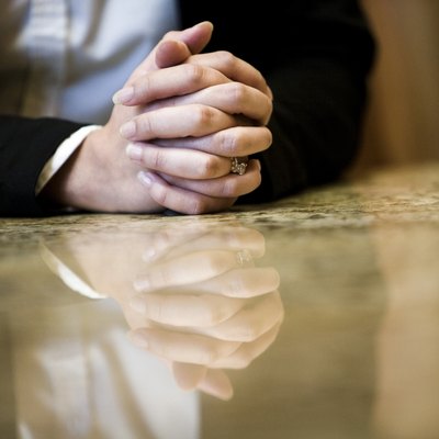 Close-up of human hands on conference table in an office