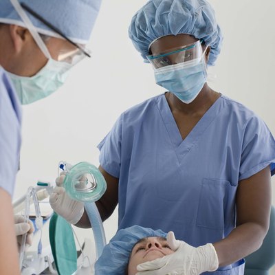 Doctors with patient in hospital