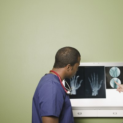 African doctor and nurse examining x-rays