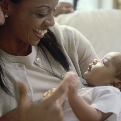 Close-up of parents looking at their son and smiling