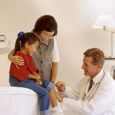 Doctor with girl and mother