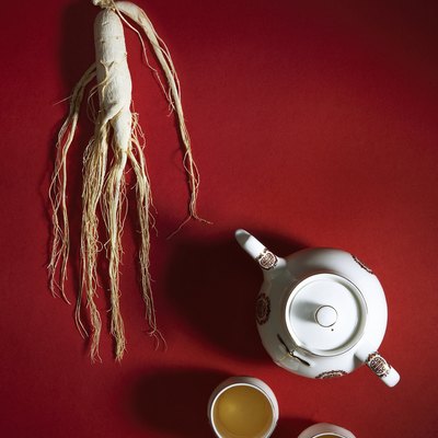 Ginseng root and tea pot with cups