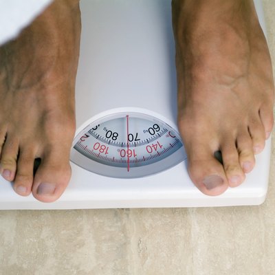 Close-up of a person's feet on a scale