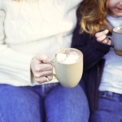 Mother and daughter with hot chocolate