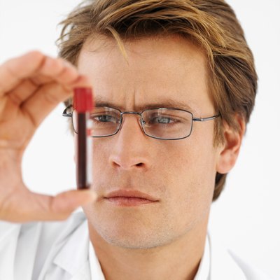 Close-up front view of a doctor holding blood sample