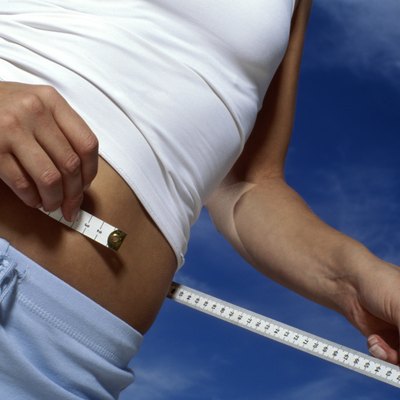 Woman measuring waist
