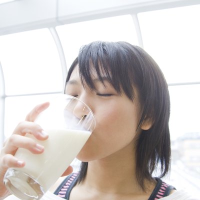 Young Woman Drinking Milk