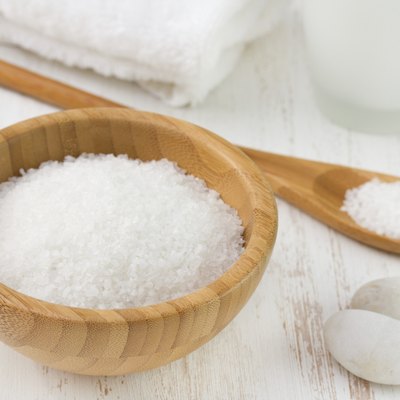 salt with spoon, towel and bottle