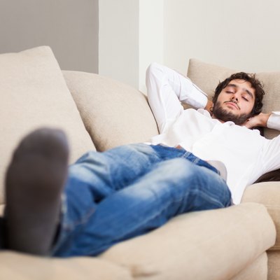 Man sleeping on his couch