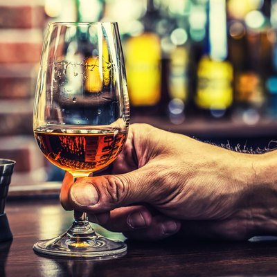 Alcoholism. Hand alcoholic and drink the distillate brandy or cognac.