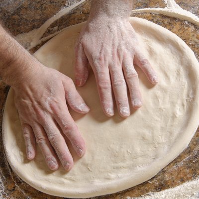 Chef Preparing pizza dough