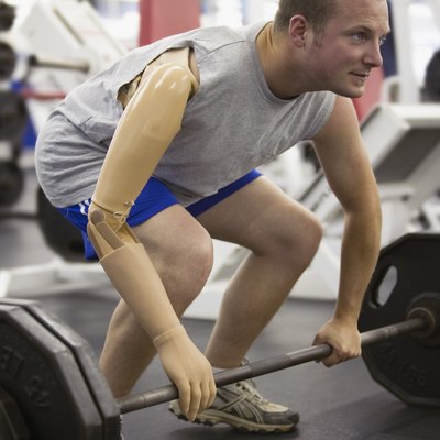 Man with prosthetic arm lifting weights