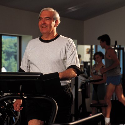 Man exercising on treadmill at gym
