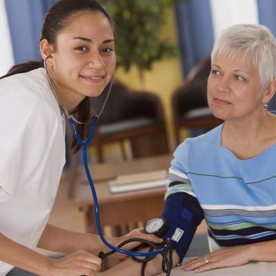 Woman getting her blood pressure taken