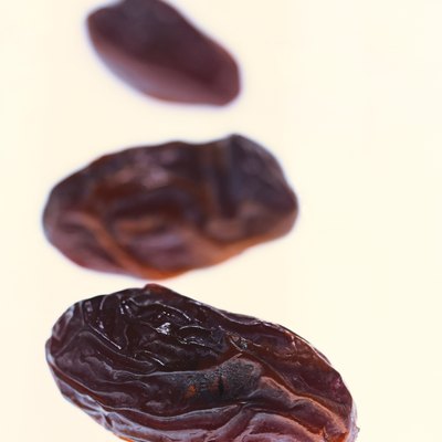 close-up of three dried prunes